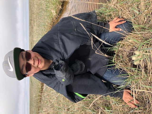 Student outdoors in field