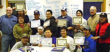 graduates holding there diplomas